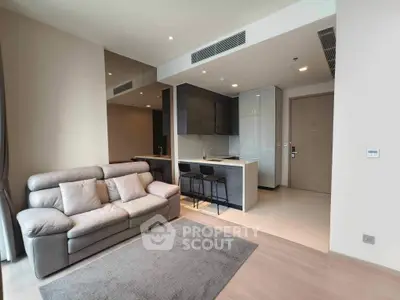 Modern living room with stylish open kitchen and cozy sofa