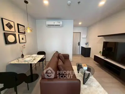 Modern living room with stylish decor, brown sofa, and wall-mounted TV in a cozy apartment.