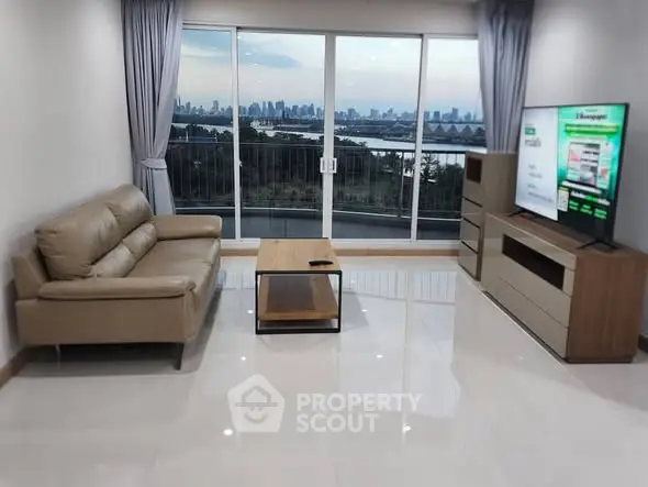 Spacious living room with stunning city view and modern furnishings