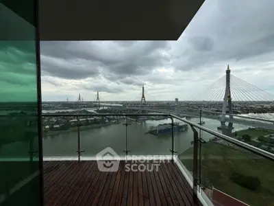 Stunning balcony view of river and iconic bridge from high-rise apartment, perfect for urban living.