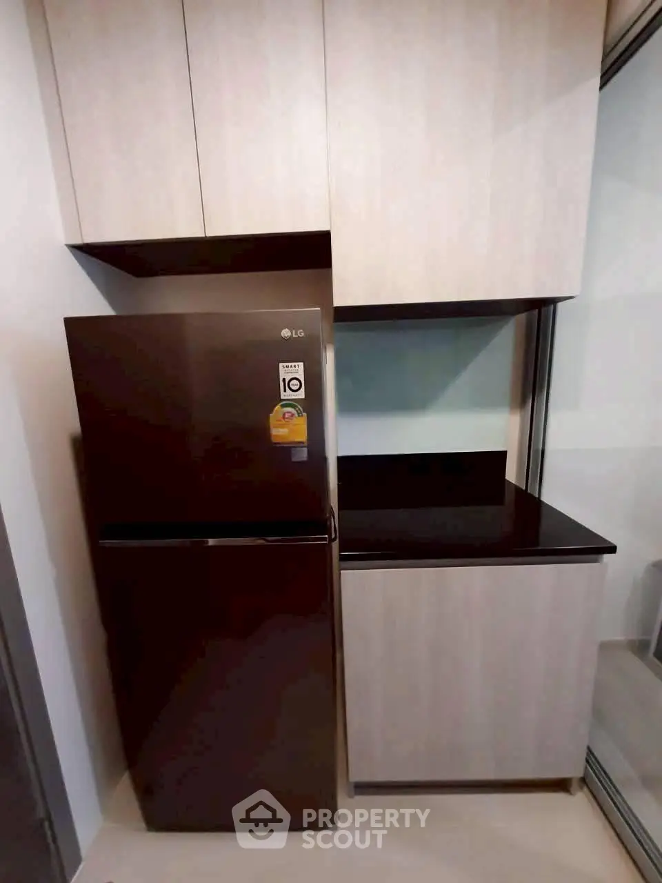 Modern kitchen with sleek cabinets and a stylish refrigerator