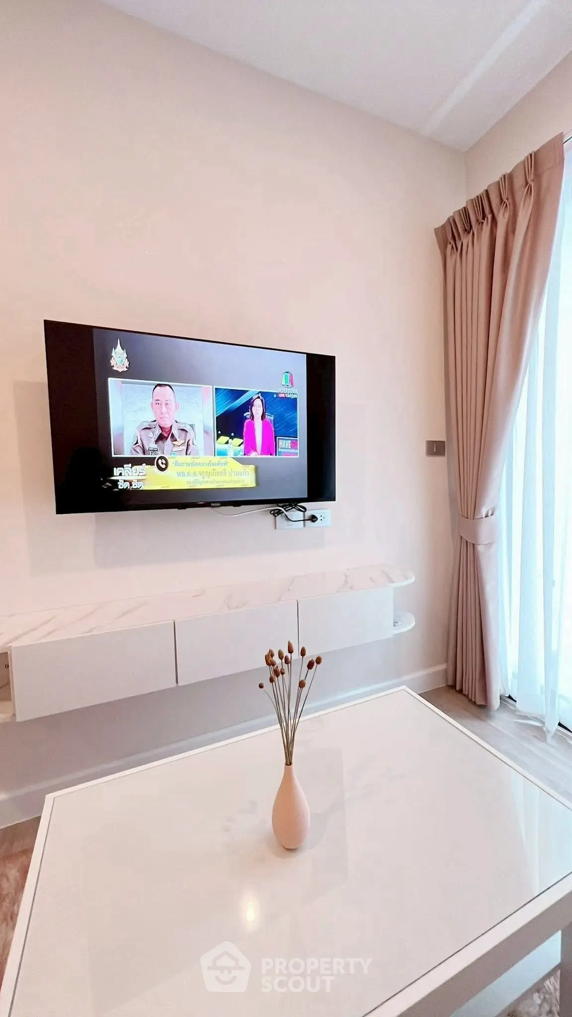 Modern living room with wall-mounted TV and elegant decor