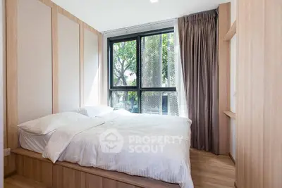 Bright and modern bedroom with large window and elegant wooden accents