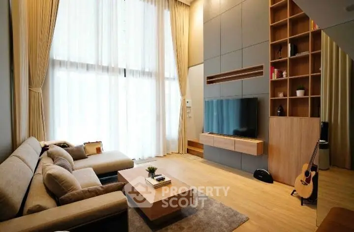 Luxurious modern living room with high ceilings and elegant decor
