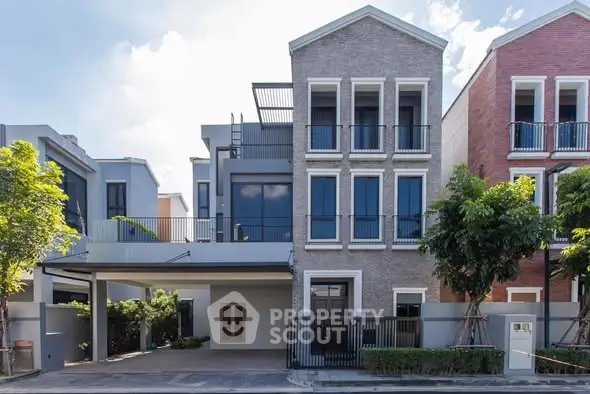 Modern townhouse with stylish facade and rooftop terrace in a vibrant neighborhood.