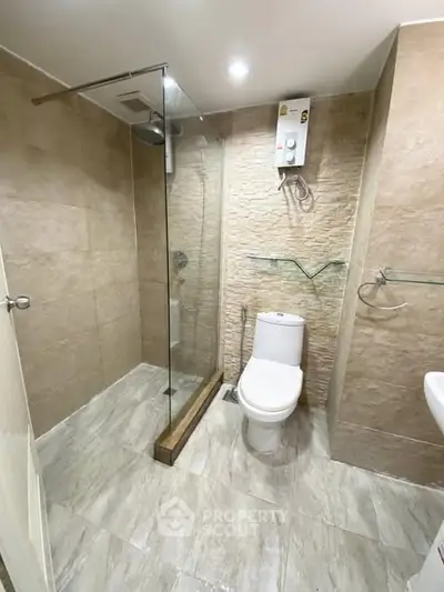 Modern bathroom with glass shower and sleek tile design