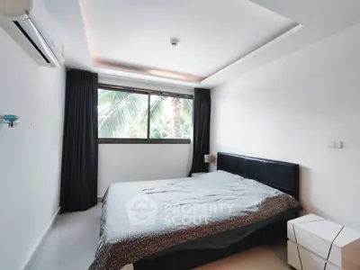 Modern bedroom with large window and minimalist decor, featuring a cozy bed and sleek air conditioning unit.