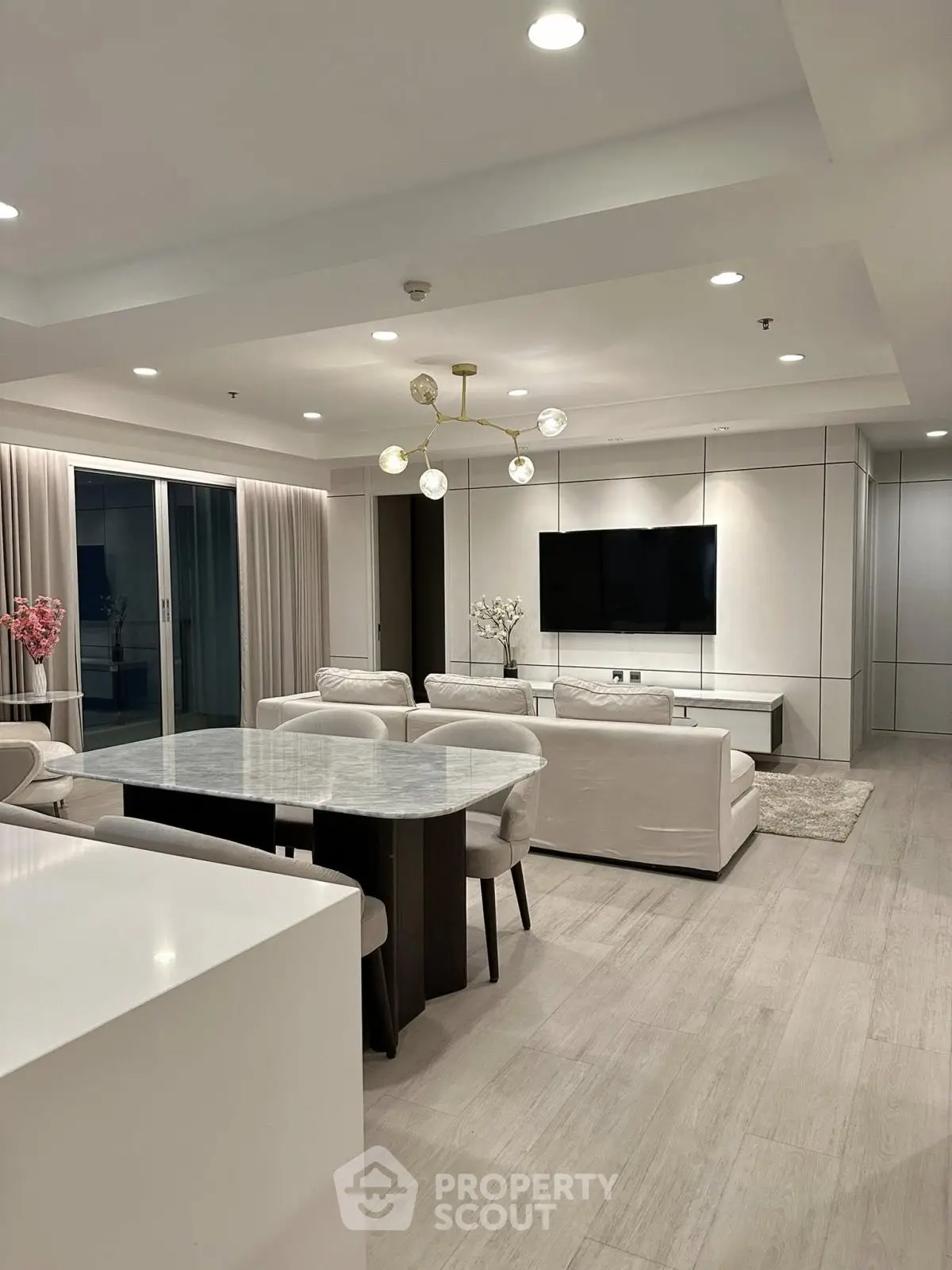 Luxurious modern living room with elegant dining area and stylish lighting