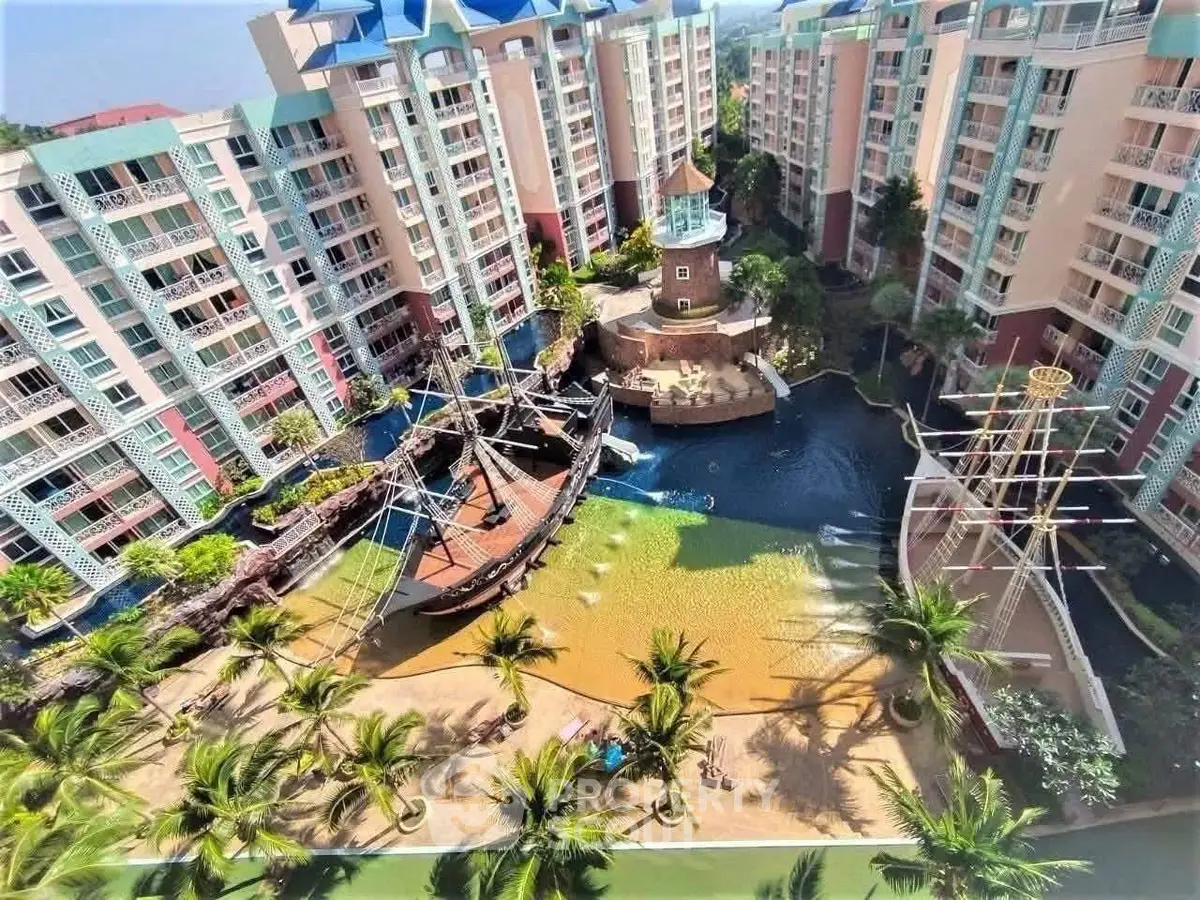 Luxurious residential complex with unique pirate ship pool and lush landscaping.