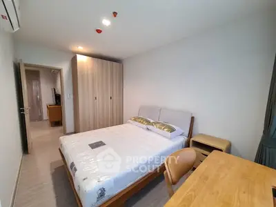 Modern bedroom with wooden furniture and ample natural light