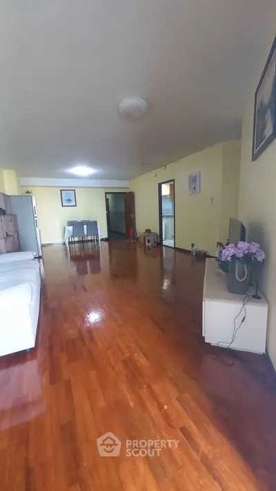 Spacious living room with wooden flooring and modern decor
