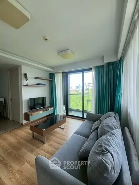 Modern living room with large windows and stylish decor