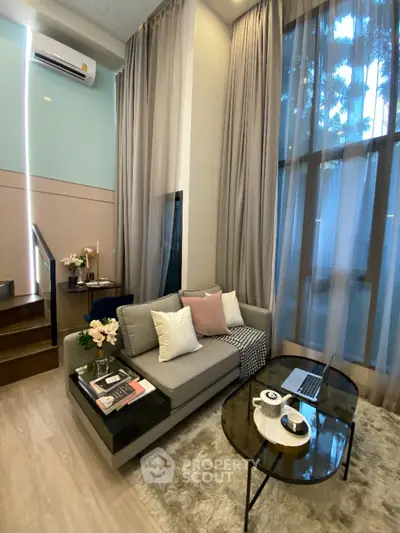 Modern living room with high ceilings and elegant decor