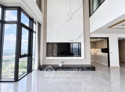 Luxurious high-rise living room with marble accents and panoramic city views