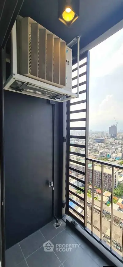 Modern balcony with city view and air conditioning unit, perfect for urban living.