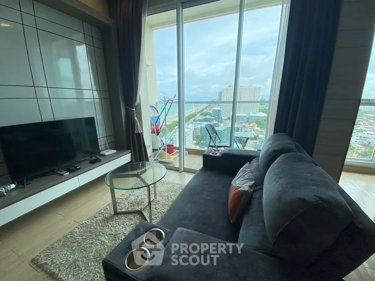 Modern living room with stunning city view and cozy seating area