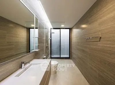 Luxurious modern bathroom with sleek design and spacious layout.
