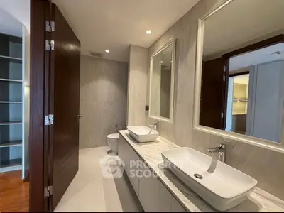 Luxurious modern bathroom with dual sinks and elegant wood accents
