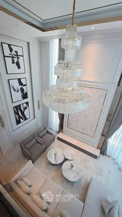 Luxurious living room with elegant chandelier and modern decor