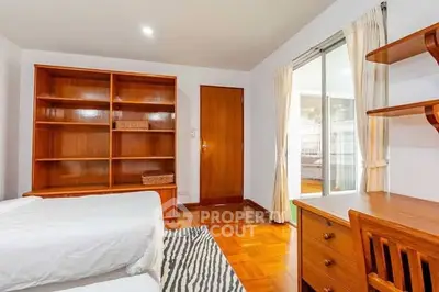 Cozy bedroom with wooden furniture and natural light