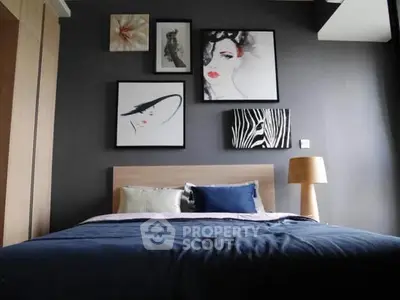 Stylish bedroom with modern art and cozy lighting in a contemporary apartment.