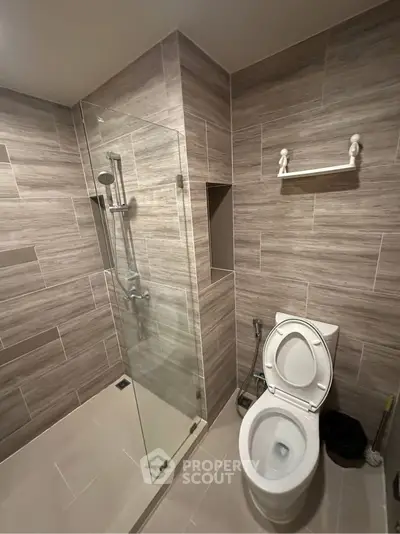 Modern bathroom with glass shower and sleek tile design
