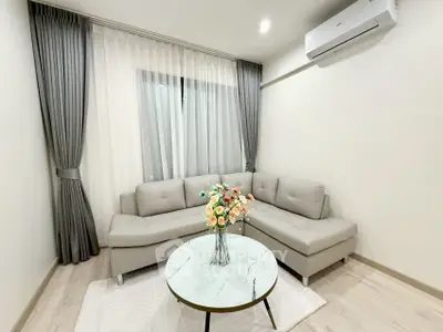 Modern living room with elegant gray sofa and stylish decor