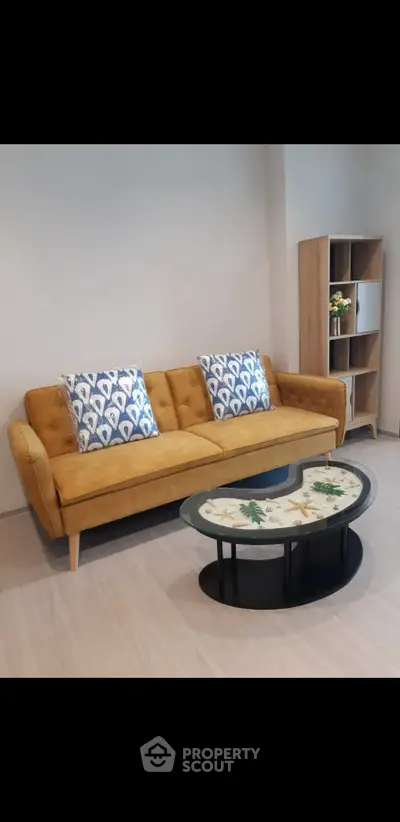 Stylish living room with mustard sofa and modern coffee table