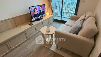 Cozy living room with modern decor and balcony access