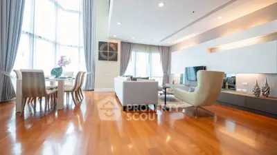 Luxurious modern living room with elegant furniture and large windows