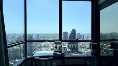 Stunning high-rise apartment with panoramic city views and elegant interior design.