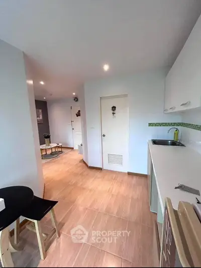 Modern kitchen with open layout and sleek design in a cozy apartment