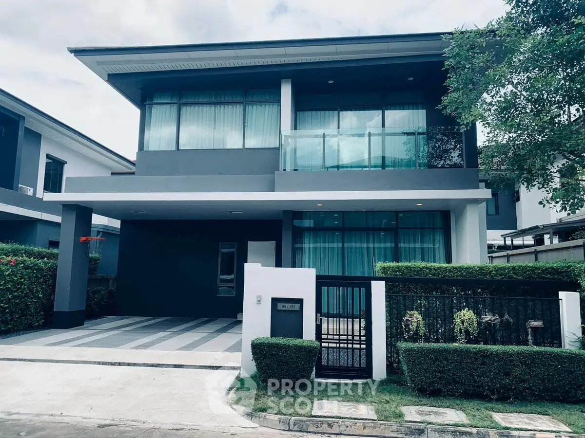 Modern two-story house with sleek design and spacious driveway