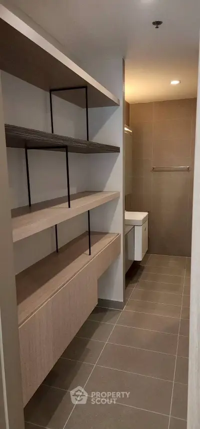Modern bathroom with sleek shelving and minimalist design