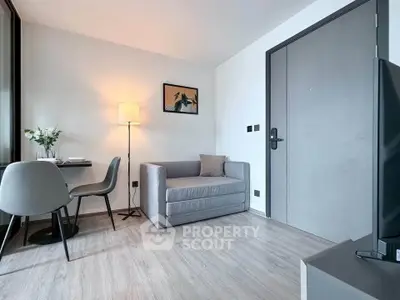 Modern living room with stylish decor and cozy seating area in a contemporary apartment.