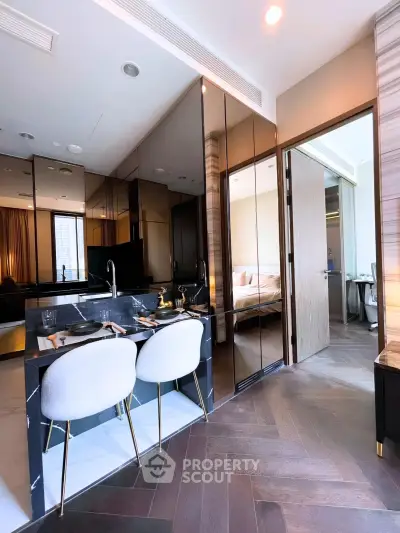 Luxurious modern kitchen with sleek design and open layout, featuring elegant dining area and stylish decor.