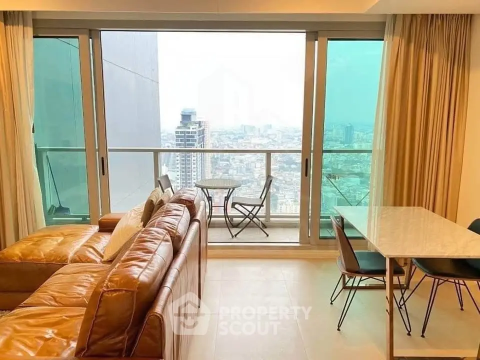 Modern living room with city view and balcony in high-rise apartment