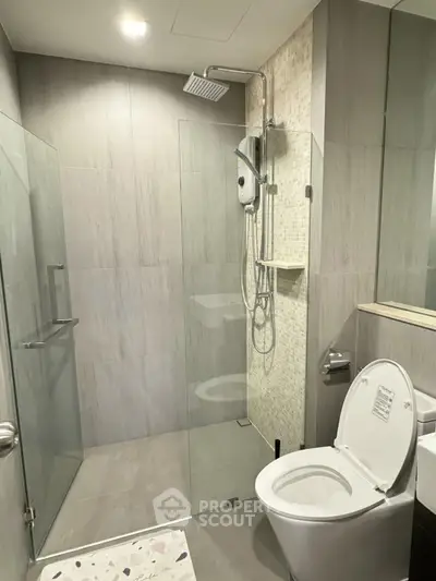 Modern bathroom with glass shower and sleek fixtures