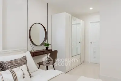 Modern bedroom with stylish decor and ample storage space