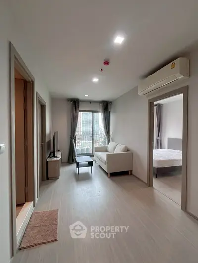 Modern apartment living room with balcony and city view
