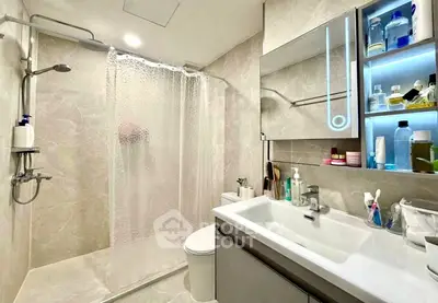 Modern bathroom with sleek fixtures and illuminated shelving