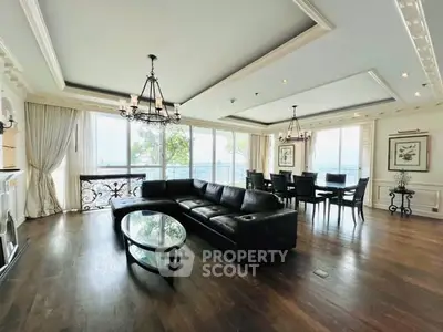 Luxurious living room with elegant decor and expansive windows offering stunning views.
