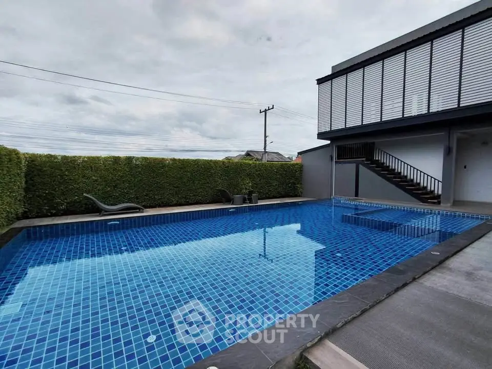 Luxurious modern home with private outdoor pool and stylish design.