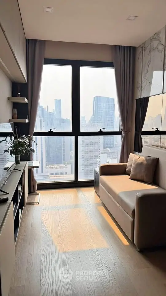 Modern living room with city view, featuring a cozy sofa and stylish decor, perfect for urban living.