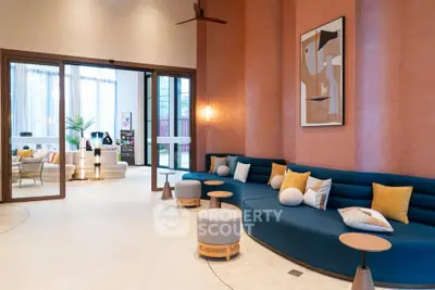 Luxurious modern living room with stylish decor and large windows