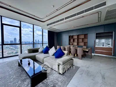 Luxurious high-rise living room with panoramic city views and modern furnishings.