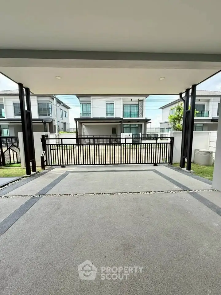 Modern residential property with spacious driveway and contemporary architecture.