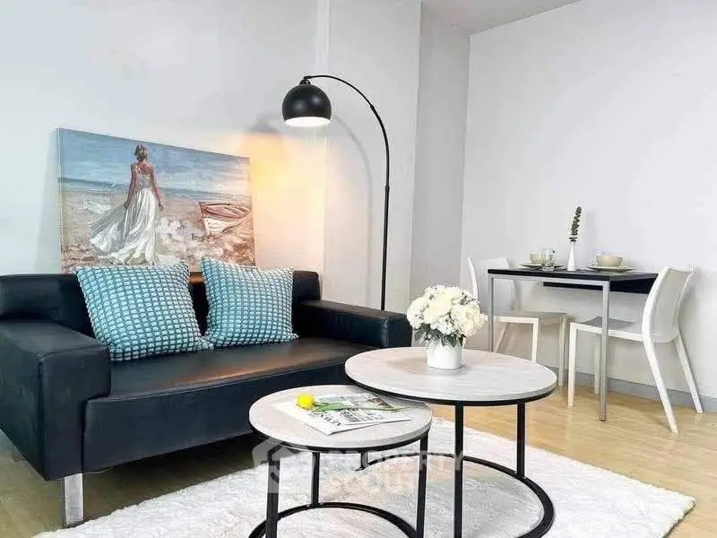 Stylish modern living room with elegant decor and cozy dining area, perfect for urban living.