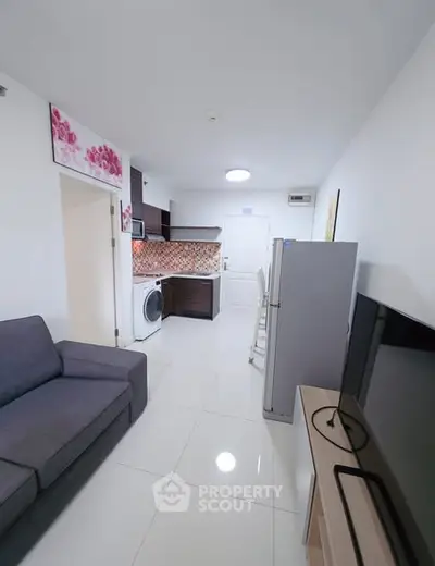 Modern apartment interior with sleek kitchen and cozy living area