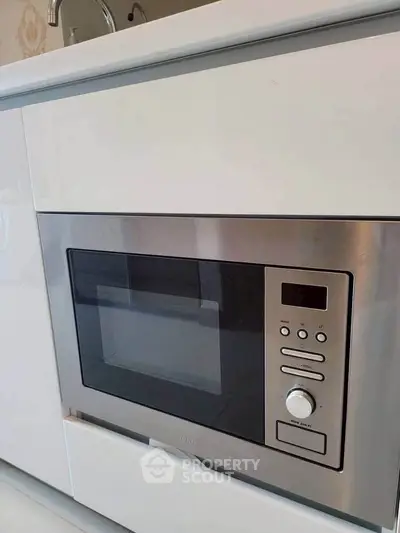 Modern built-in microwave in sleek kitchen setting